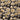 Pattern of stylized mushrooms with yellow and white colors on a black background