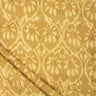 Textured fabric with a subtle pattern on a gold background